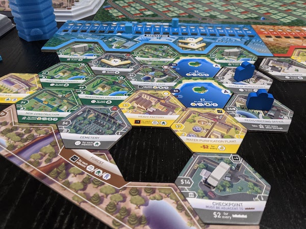 Suburbia Inc mid game showing off a border tile, as well as a little suburb I created.